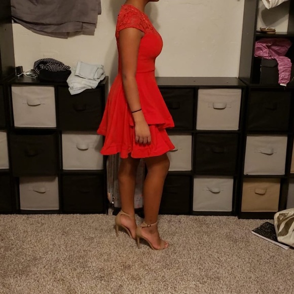 A red dress with lace accents - Picture 3 of 4